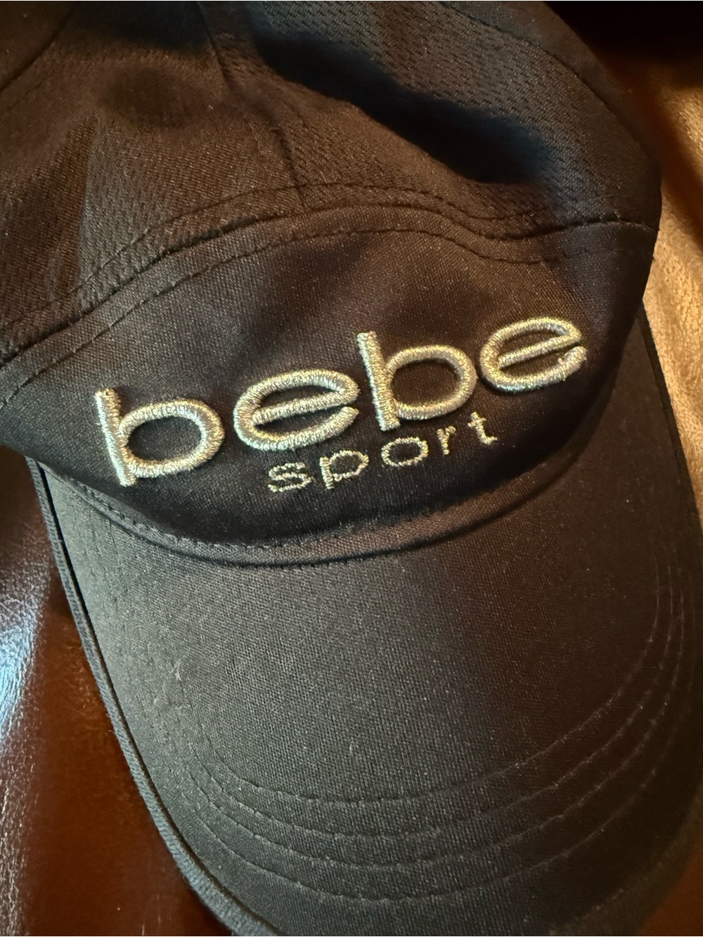 Bebe Sport Black Baseball Cap with embroidery adjustable does have some makeup
